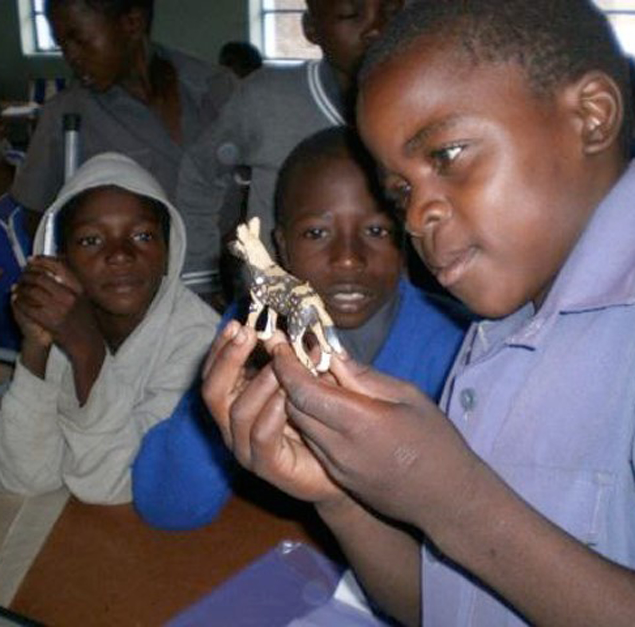 zimb-children-with-painted-dog-toy