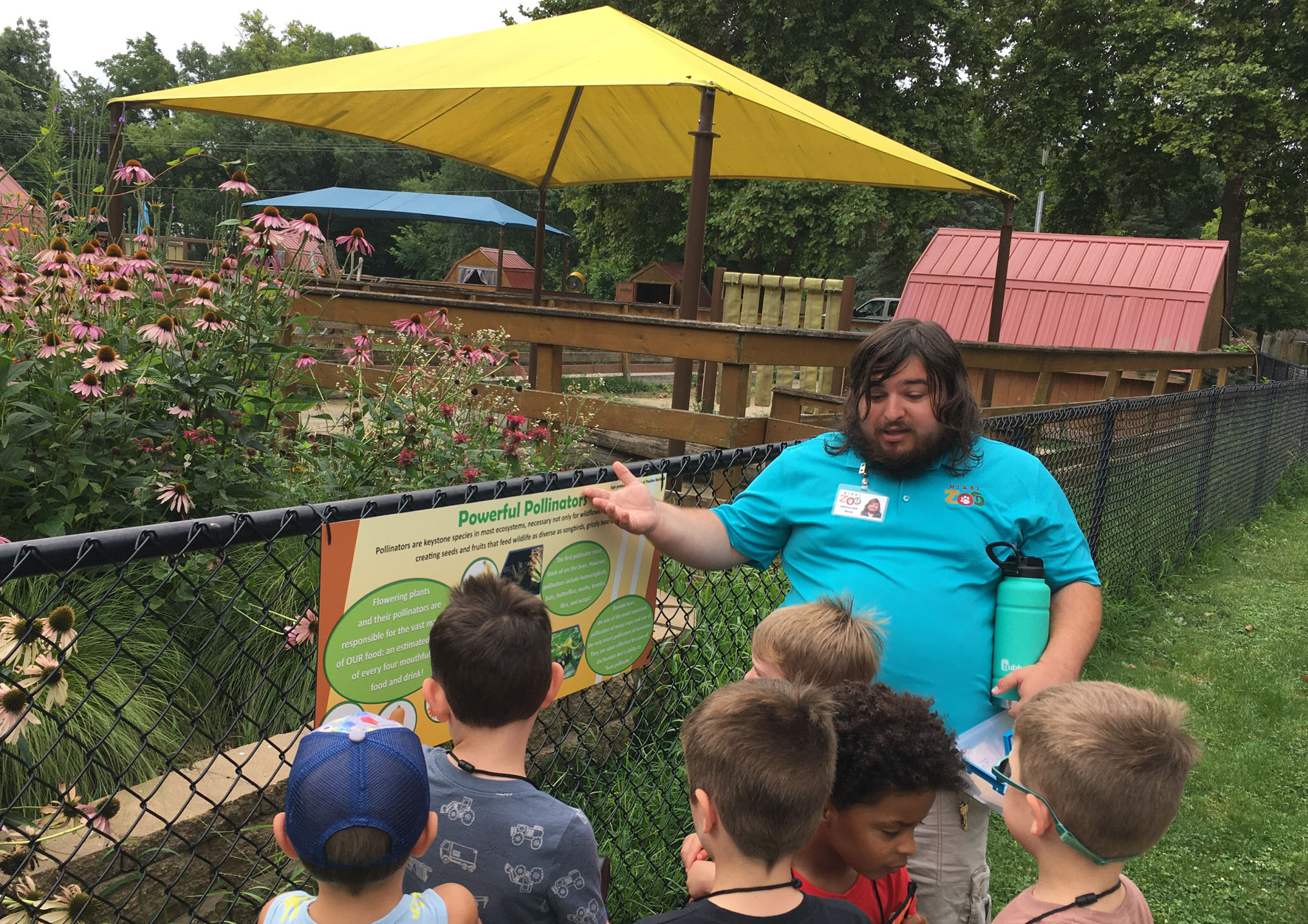 educator-shows-pollinator-garden-to-kids
